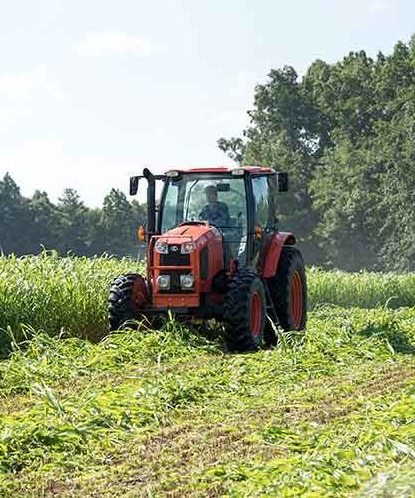 Tractor plowing in field 